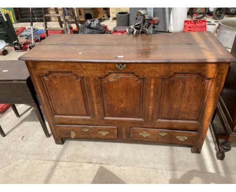 A GEORGE III OAK COFFER WITH THREE PANEL FRONT AND CROSSBANDED DRAWERS TO BASE, 56" WIDE 