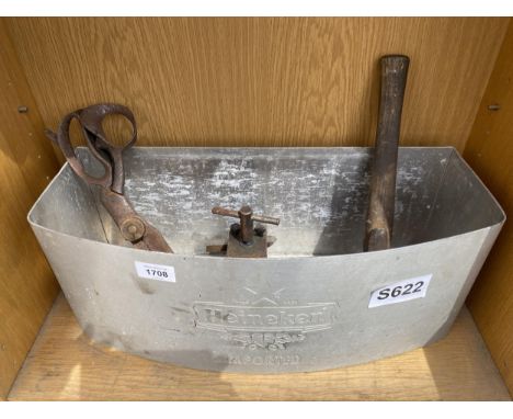 A HEINEKEN BEER STAND, A PAIR OF LARGE SCISSORS, A VICE AND AN AXE 