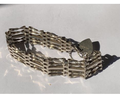A SILVER FIVE BAR GATE BRACELET 