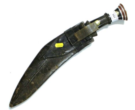 A Kukri knife and leather scabbard