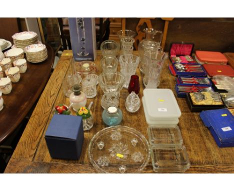 A quantity of various glassware to include jugs, vases, jelly moulds, oil lamp etc.