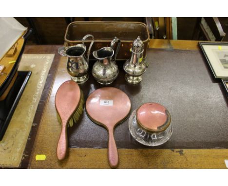 An enamel decorated dressing table set; silver plated sugar sifter; two silver plated jugs etc. 