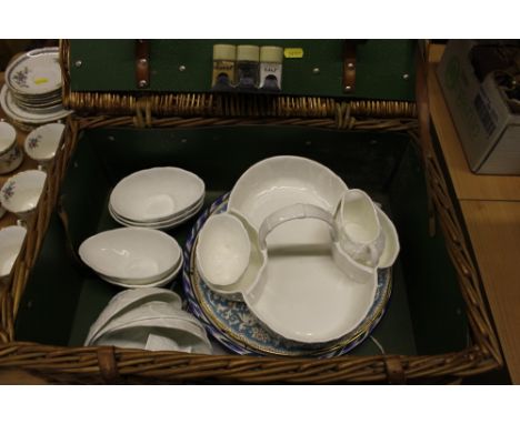 A wicker picnic hamper and contents to include a Coalport strawberry dish and matching bowls etc.