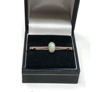 Antique 15ct gold opal brooch set with  central opal that measures approx 13mm by 5.5mm frame xrt tested as 15ct gold measure