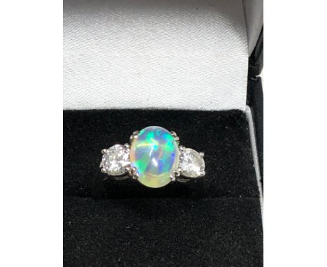 Fine plat opal &amp; diamond ring set with centralop[al that measures approx 11.5mm by 8mm with diamond each side est 1.5ct d