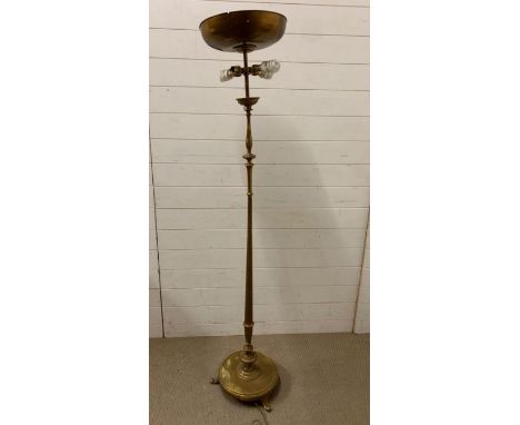 A brass standard light on circular weighted base and paw feet 