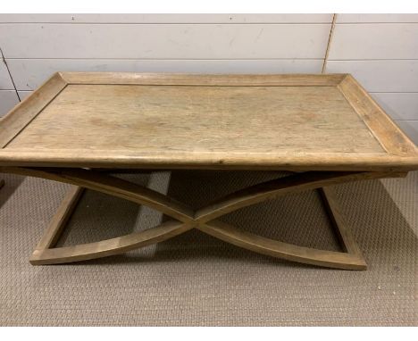 Two light oak X framed side tables (111cm x 58cm x 44cm and 60cm x 59cm x 40cm)