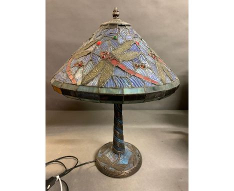 A Tiffany style table lamp with dragon fly design to shade and base 