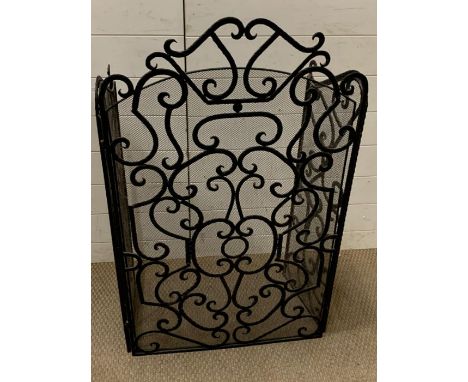 A Wrought iron firescreen