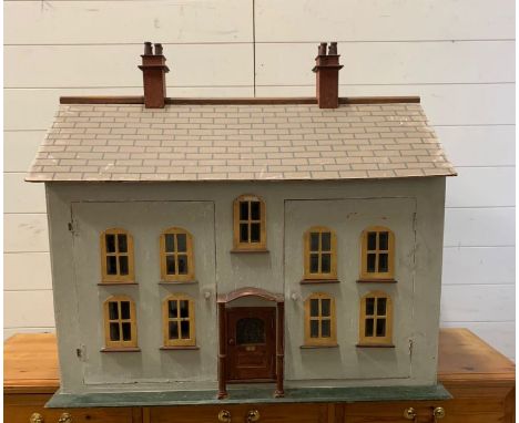 A vintage large wooden dolls house 