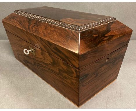 A Rosewood sarcophagus shape tea caddy, the interior with a pair of hinged lidded canisters AF