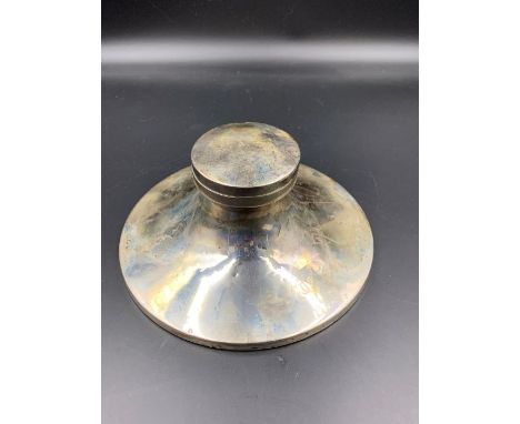 A substantial silver inkwell with indistinct hallmarks