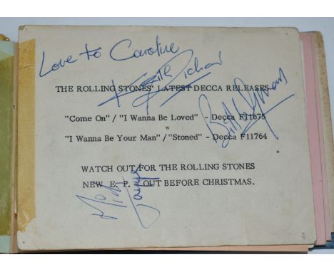 A 1960s autograph book containing a 1964 Rolling Stones promotional card signed by Mick Jagger, Keith Richards and Bill Wyman