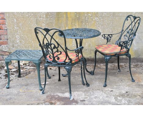 Metal garden table, two chairs and a side table