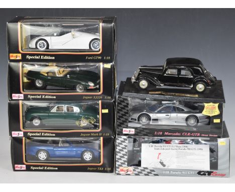 Seven Maisto 1:18 scale diecast model vehicles including Mercedes CLK-GTR Street Version, Porsche 911 GT1, Ford GT90, Jaguar 