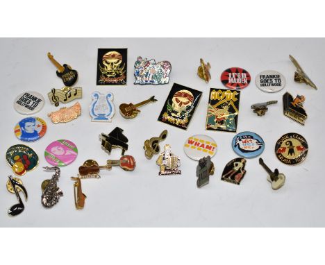 Thirty-three enamel and similar music related badges including Motorhead, AC/DC, Michael Jackson, Wham!, Wet Wet Wet etc.&nbs