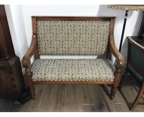 VICTORIAN OAK FRAMED HALL SEAT the double seat with floral upholstery, set in light oak frame with downward swept arms and tu