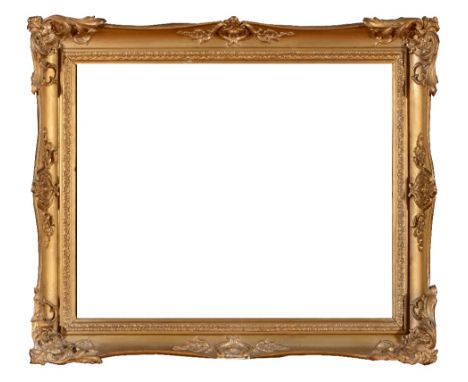 A 19TH CENTURY GILT GESSO FRAME of swept Rococo form, currently incorporating a print after George Morland, rebate size 45cm 