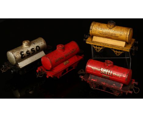 A collection of Hornby O Gauge tinplate tank wagons, including a National Benzole Mixture tank wagon, yellow body, 'NATIONAL 