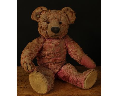 A rare 1930's Chad Valley pink mohair jointed teddy bear, amber and black glass eyes, pronounced snout with vertically brown 