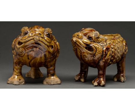 Two Art Pottery spoon warmers or vases attributed to Burmantofts, late 19th c,&nbsp;as a grimacing warty creature on three le
