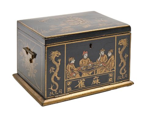 A mahjong set in japanned cabinet, c1930, of bone and bamboo tiles and sticks, cabinet with hinged brass handles, 18cm h, 26c