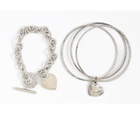 Tiffany &amp; Co. A silver bracelet and three bangles united by a heart, bracelet 21cm l, maker's marks, 58g  Good second han