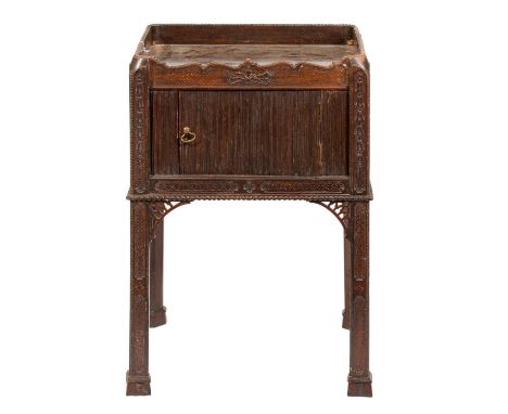 A carved mahogany tray top commode, early 20th c, with mock tambour shutter-door, 75cm h; 43 x 49cm  Top scratched and worn