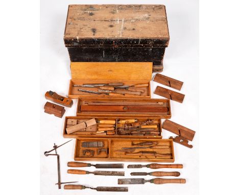A tool chest and miscellaneous woodworking tools, early 20th c, the interior with lidded compartment and removable trays, the
