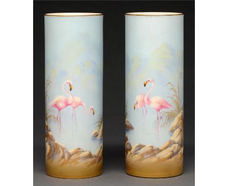 A pair of Royal Worcester cylindrical vases, 1921, painted by G Johnson, both signed, with flamingos in a continuous landscap