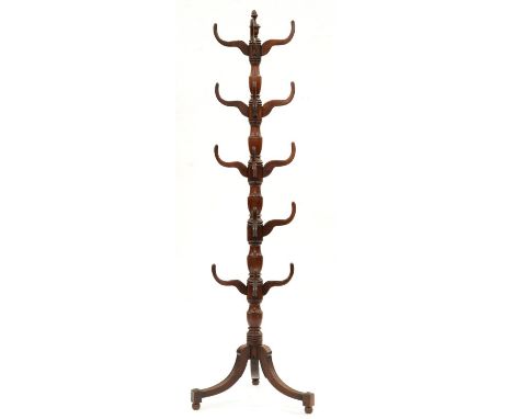 A George IV mahogany hat stand, c1830, the turned shaft with vase knops and acorn finial, on tripod, 199cm h  Acorn finial br