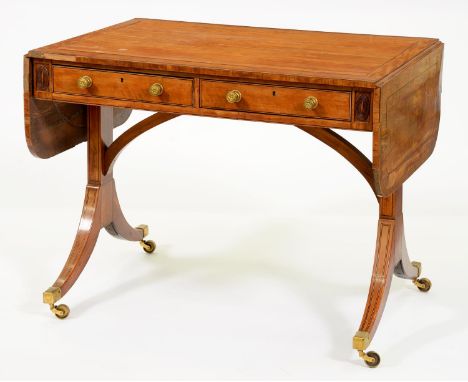 A George III satinwood, rosewood and line inlaid sofa table,&nbsp; the drawers and opposing blind drawers to the frieze flank