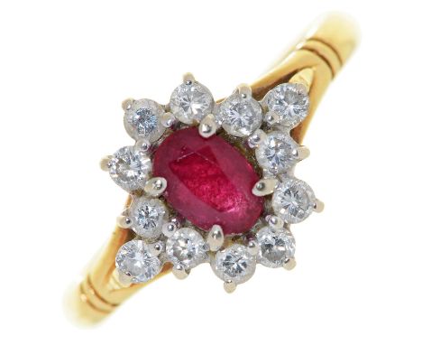 A ruby and diamond cluster ring,&nbsp;&nbsp; in 18ct gold, import marked, London 1989, 3.5g, size N  Good condition