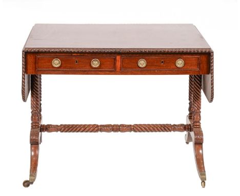 A William IV mahogany sofa table, the top crossbanded in rosewood within gadroon carved lip, brass castors, 74cm h; 76 x 149c