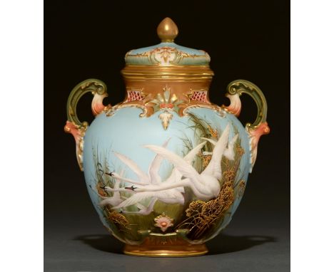 A Royal Worcester scroll handled pot pourri jar and cover, 1900, painted by C Baldwyn, signed, with swans on an eggshell blue