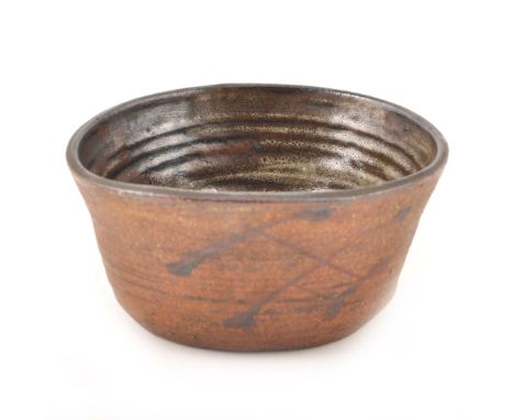 A squeezed stoneware bowl by Janet Leach for the Leach Pottery, a squeezed stoneware bowl, glazed interior, hatch design to e