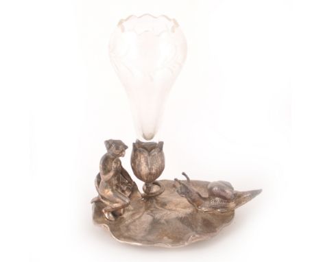 An Art Nouveau silvered metal figural epergne stand, by WMF, the base cast as a maiden knelt on a lily pad with a snail, with