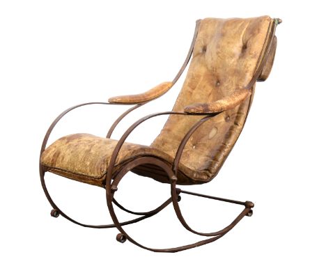 A Victorian wrought iron and leather rocking chair, in the manner of R W Winfield, late 19th century, height 100cm.