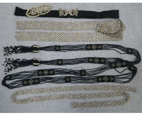 A 1920'S BLACK BUGLE BEAD PIECE OF FLAPPER JEWELLERY, the beading intermittently embroidered with black and white panels, the