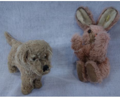 STEIFF; A VINTAGE PLUSH DOG, with button, 26cm long and a bunny, with button, 26cm long (2)