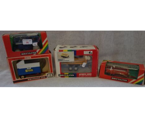 BRITAINS; A FORD TW20 TRACTOR, a tipping trailer, an animal trailer and a rotary manure spreader (4) (all boxed, boxes with w