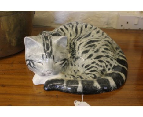 A studio ceramic of a sleeping cat