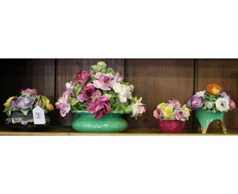 A series of four early 20th century graduated Crown Staffordshire ceramic bouquets of flowers in bowls