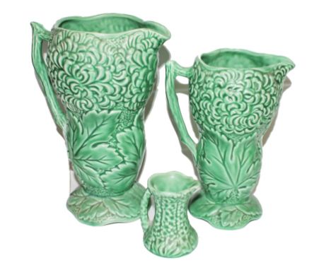 Three Sylvac early 20th century ceramic jugs with stylized green leaves and foliage, 22cm, 18cm and 7cm respectively 