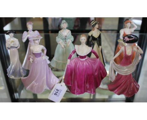 A selection of eight Coalport ceramic figurines of lady's in multicoloured dresses, each 13cm high approx