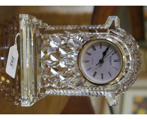 A Waterford Crystal cut glass cased quartz mantle clock with domed top on a stepped base, 19cm high