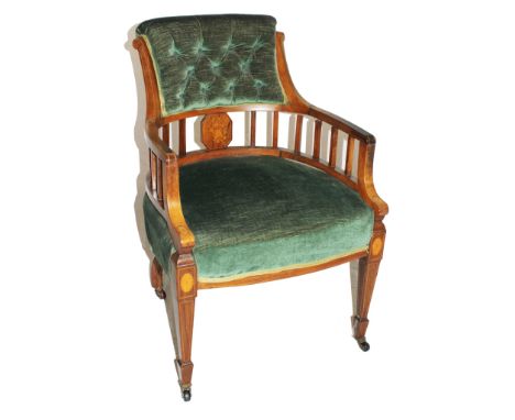 An Edwardian rose wood armchair in the Sheraton style with fabric upholstered button back support, all over string inlay, spi