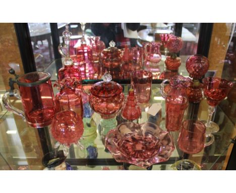 An eclectic range of ruby glass vanity table and household glassware, to include jugs, bowls, beakers, oil lamp, etc (13)