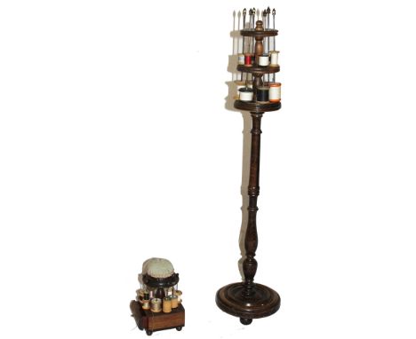A Victorian treen, three tier cotton stand with spear shaped brass supports on a turned central column and base (evidence of 