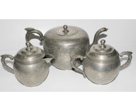 A Chinese early 20th century pewter tea service with embossed designs